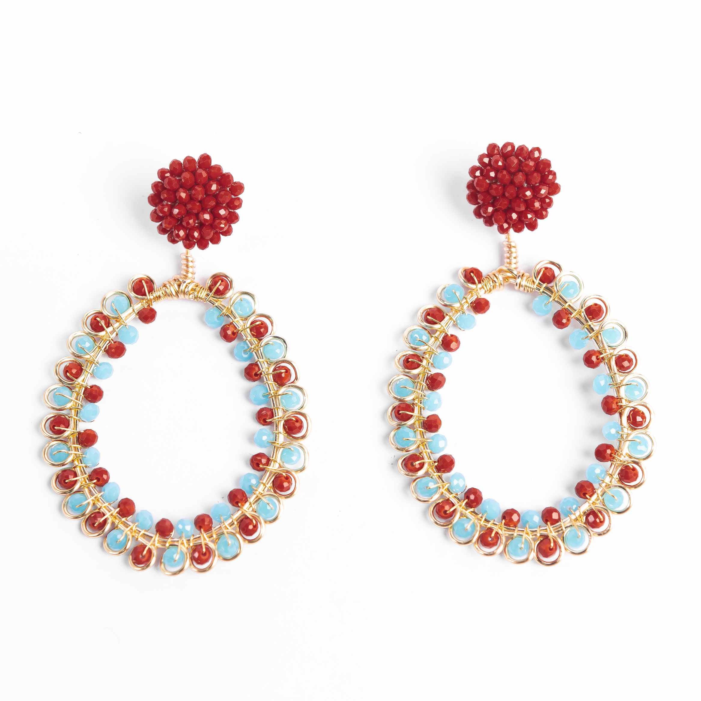 Pair of hoop earrings with red and blue beads on a white background